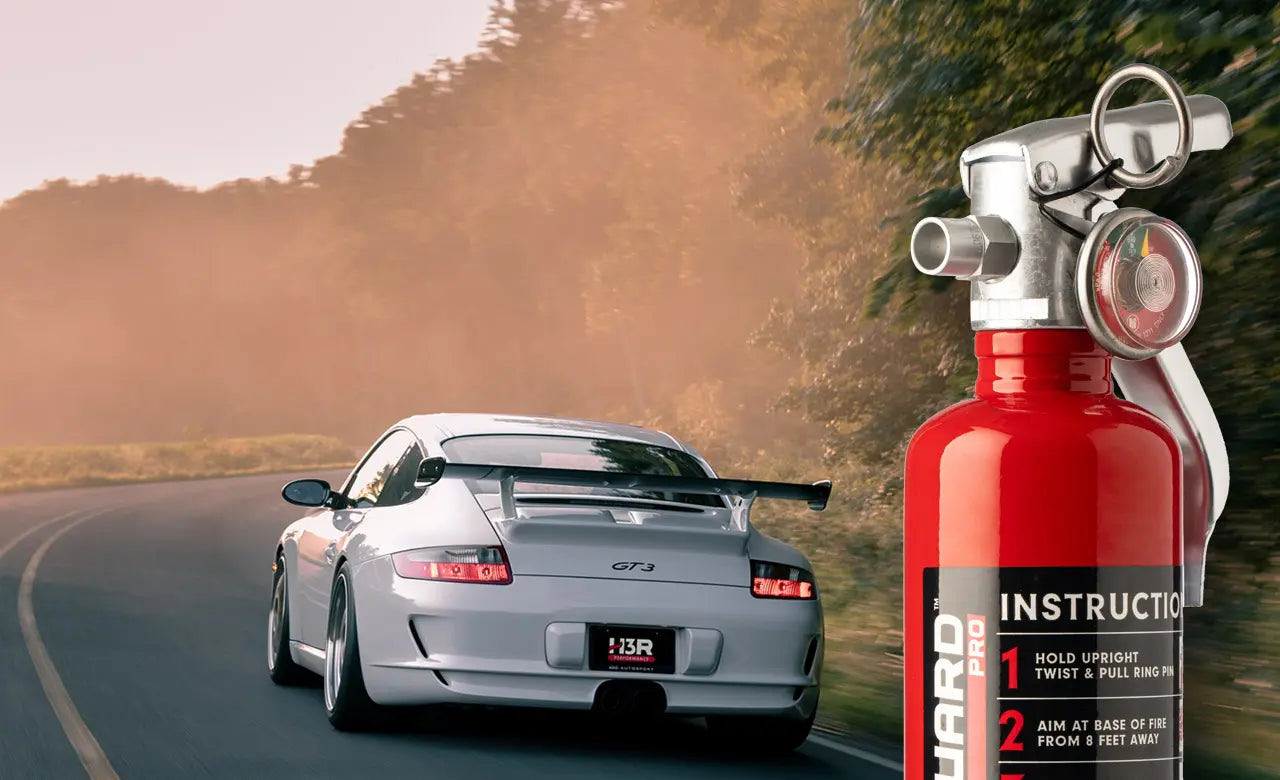 Halon fire extinguisher in front of a sports car